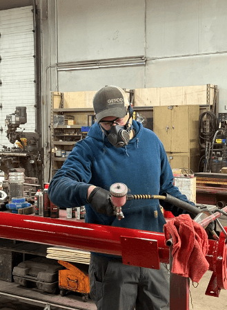 Technician servicing a drill rig